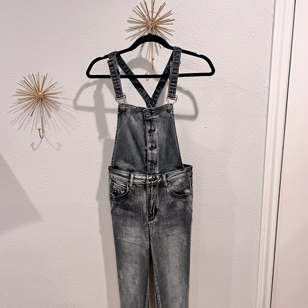 Selling this fitted denim overall jumpsuit. With fringe bottom